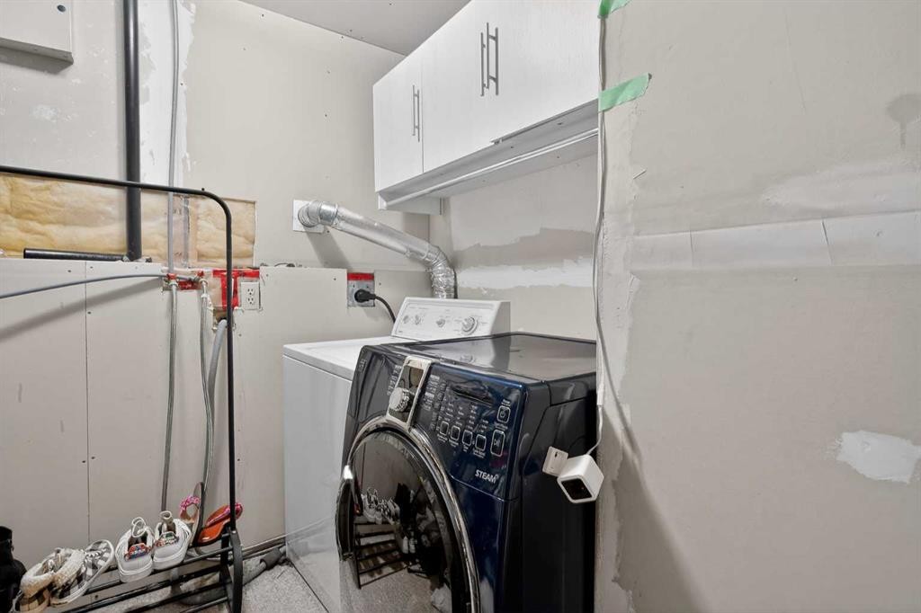 107 Mt Allan Circle Se, Calgary, AB - Indoor Photo Showing Laundry Room