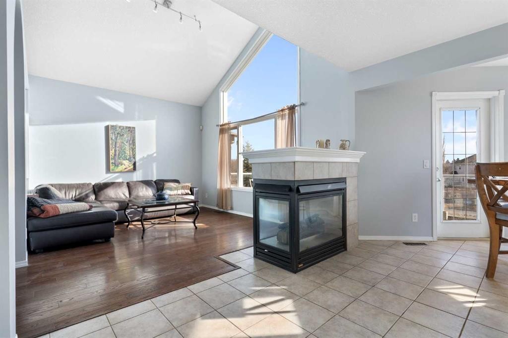 202 Schooner Close Nw, Calgary, AB - Indoor Photo Showing Living Room With Fireplace