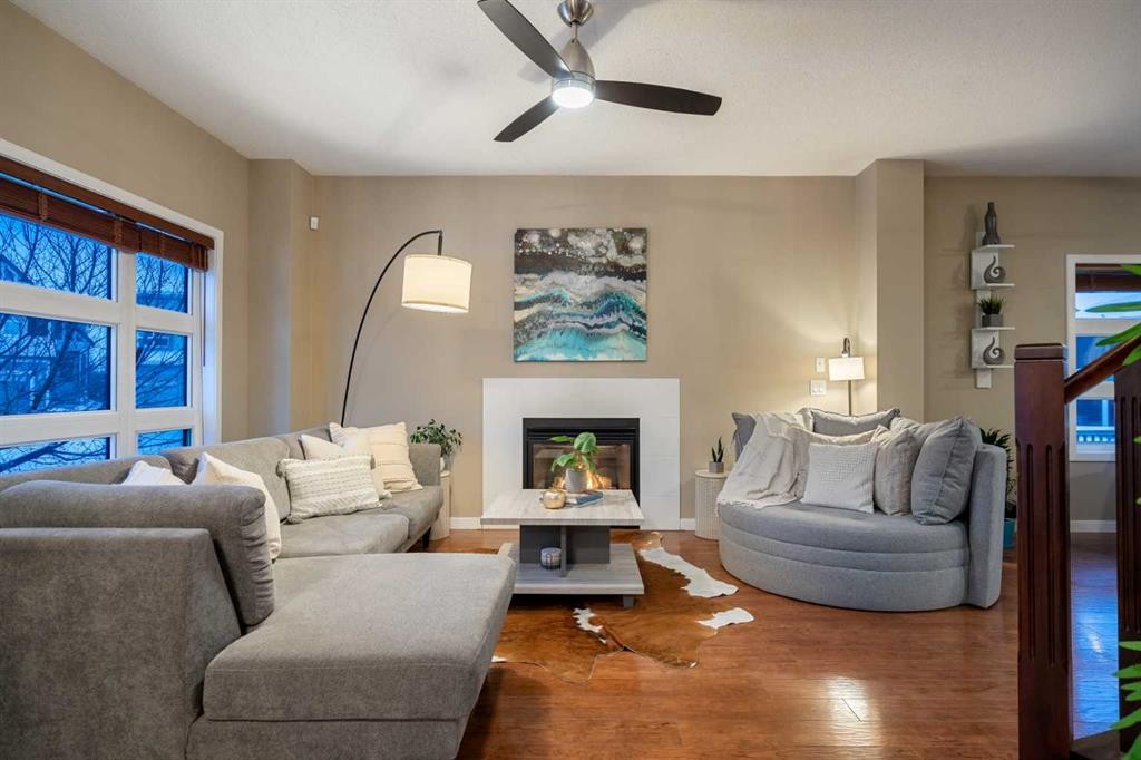 118 Walden Manor Se, Calgary, AB - Indoor Photo Showing Living Room With Fireplace