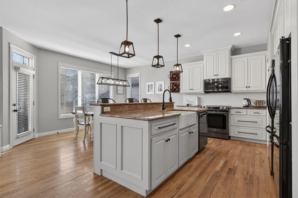 208 Cimarron Drive, Okotoks, AB - Indoor Photo Showing Kitchen With Upgraded Kitchen