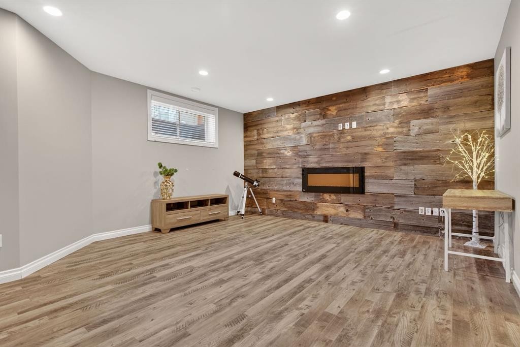 208 Cimarron Drive, Okotoks, AB - Indoor Photo Showing Other Room With Fireplace