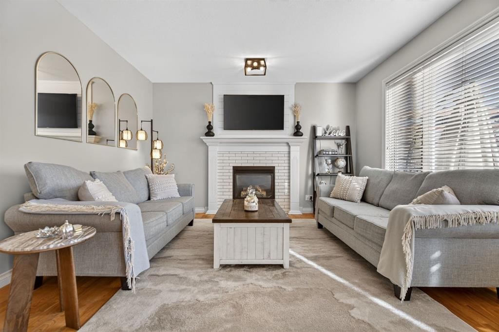 208 Cimarron Drive, Okotoks, AB - Indoor Photo Showing Living Room With Fireplace