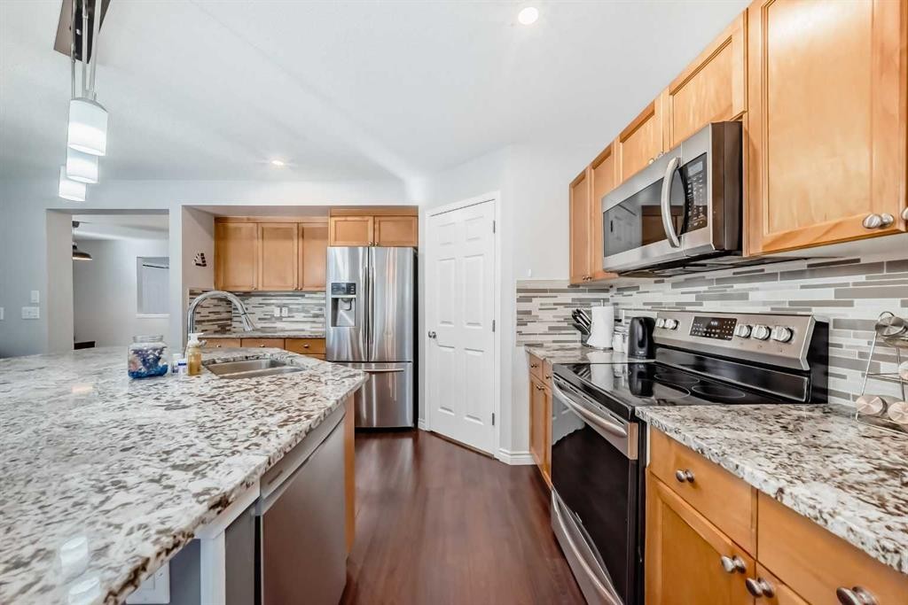 574 Chaparral Drive Se, Calgary, AB - Indoor Photo Showing Kitchen With Stainless Steel Kitchen With Double Sink With Upgraded Kitchen