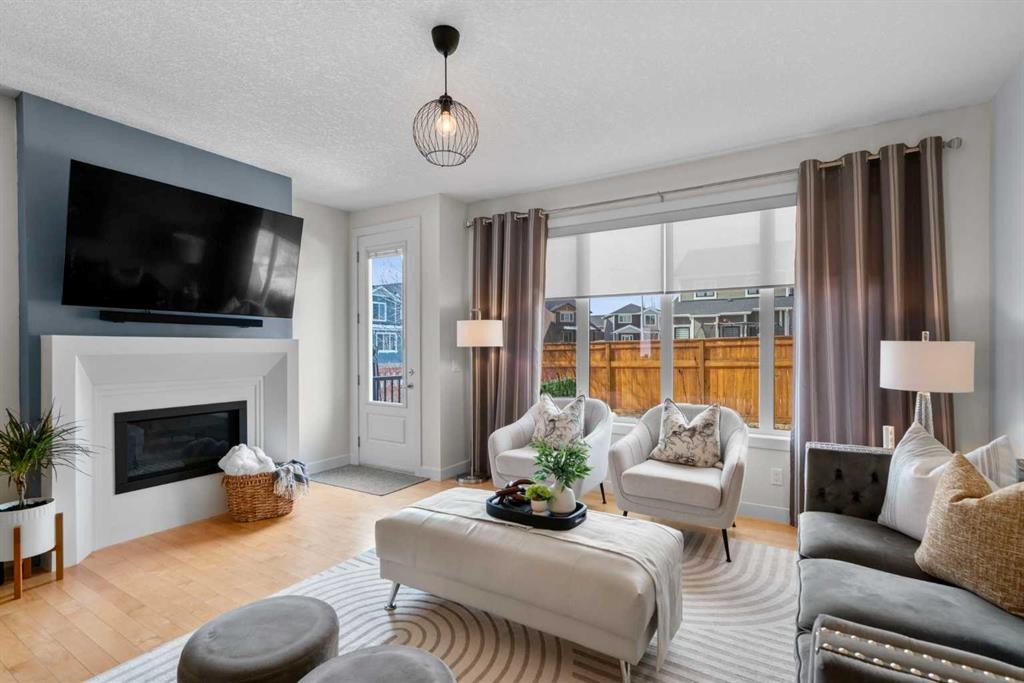 25 Fireside Landing, Cochrane, AB - Indoor Photo Showing Living Room With Fireplace