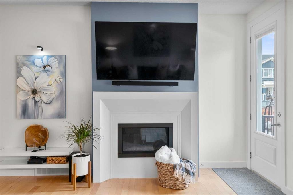 25 Fireside Landing, Cochrane, AB - Indoor Photo Showing Living Room With Fireplace