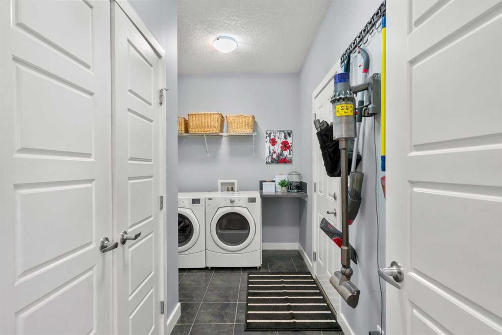25 Fireside Landing, Cochrane, AB - Indoor Photo Showing Laundry Room