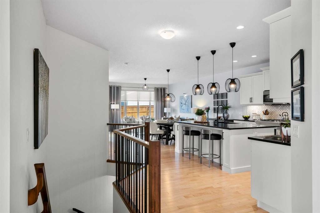 25 Fireside Landing, Cochrane, AB - Indoor Photo Showing Kitchen With Upgraded Kitchen