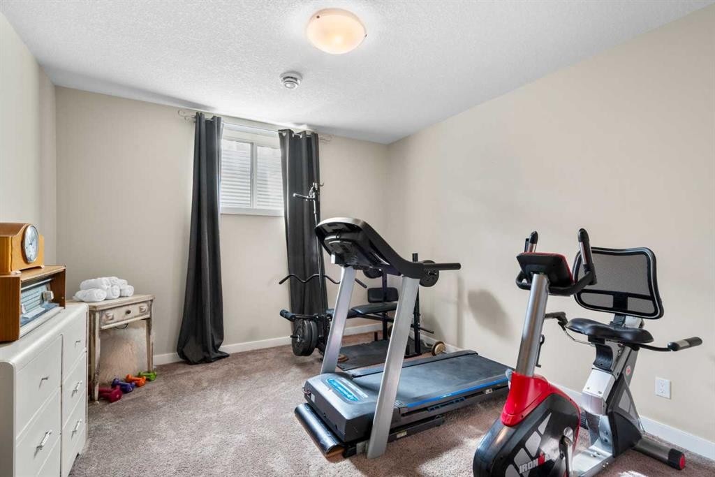25 Fireside Landing, Cochrane, AB - Indoor Photo Showing Gym Room