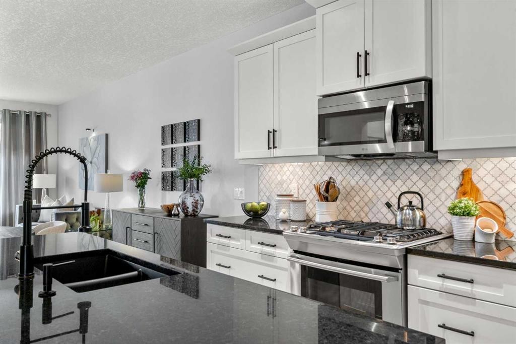 25 Fireside Landing, Cochrane, AB - Indoor Photo Showing Kitchen With Double Sink With Upgraded Kitchen