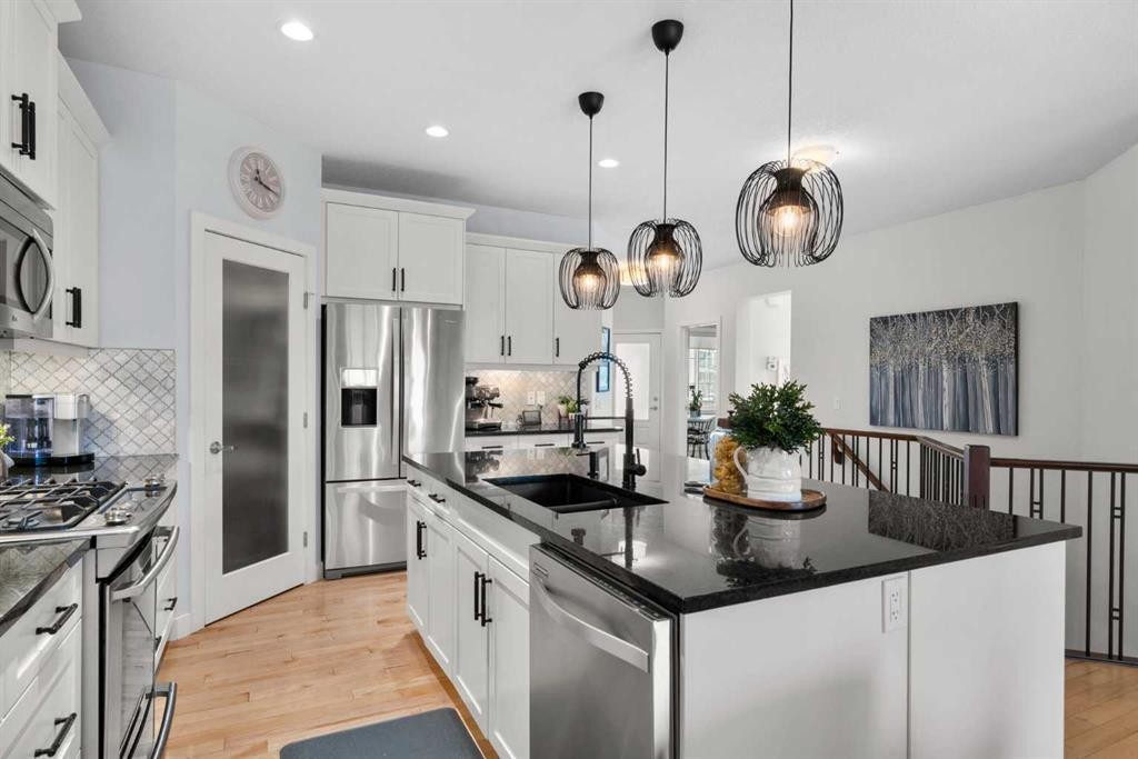 25 Fireside Landing, Cochrane, AB - Indoor Photo Showing Kitchen With Upgraded Kitchen