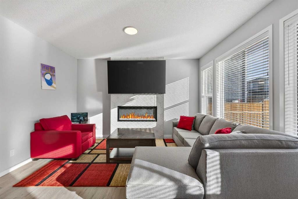 78 Corner Meadows Row Ne, Calgary, AB - Indoor Photo Showing Living Room With Fireplace