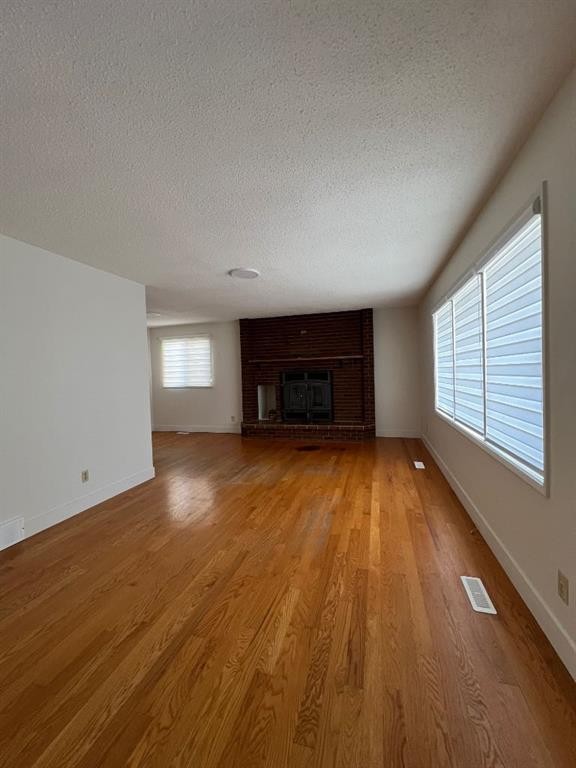 6807 Huntchester Road Ne, Calgary, AB - Indoor Photo Showing Other Room With Fireplace