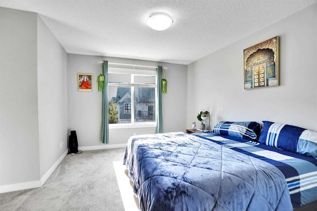 1322 Walden Drive Se, Calgary, AB - Indoor Photo Showing Bedroom