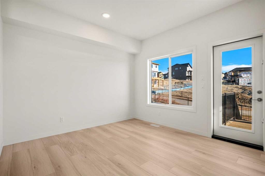 31 Heritage Heath, Cochrane, AB - Indoor Photo Showing Other Room