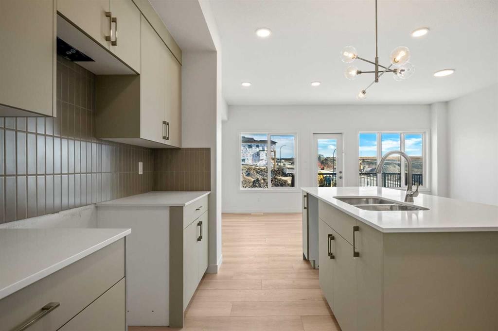 31 Heritage Heath, Cochrane, AB - Indoor Photo Showing Kitchen With Double Sink