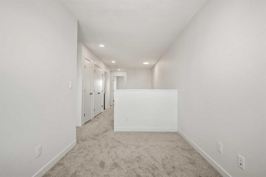 31 Heritage Heath, Cochrane, AB - Indoor Photo Showing Other Room
