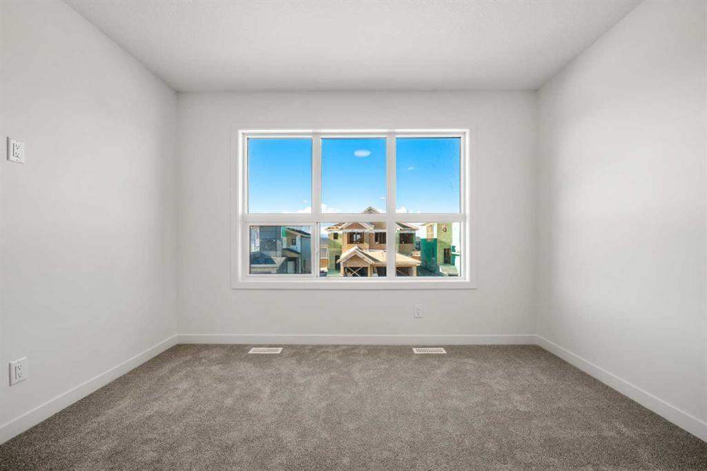 31 Heritage Heath, Cochrane, AB - Indoor Photo Showing Other Room