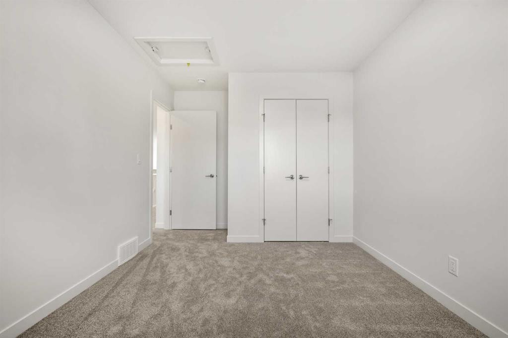 31 Heritage Heath, Cochrane, AB - Indoor Photo Showing Other Room