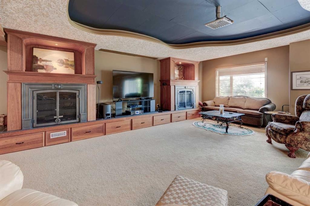 49 Arbour Crest Heights Nw, Calgary, AB - Indoor Photo Showing Living Room With Fireplace