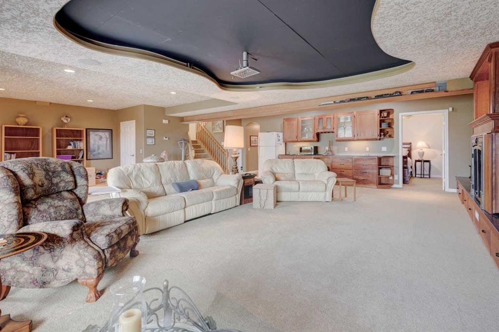 49 Arbour Crest Heights Nw, Calgary, AB - Indoor Photo Showing Living Room