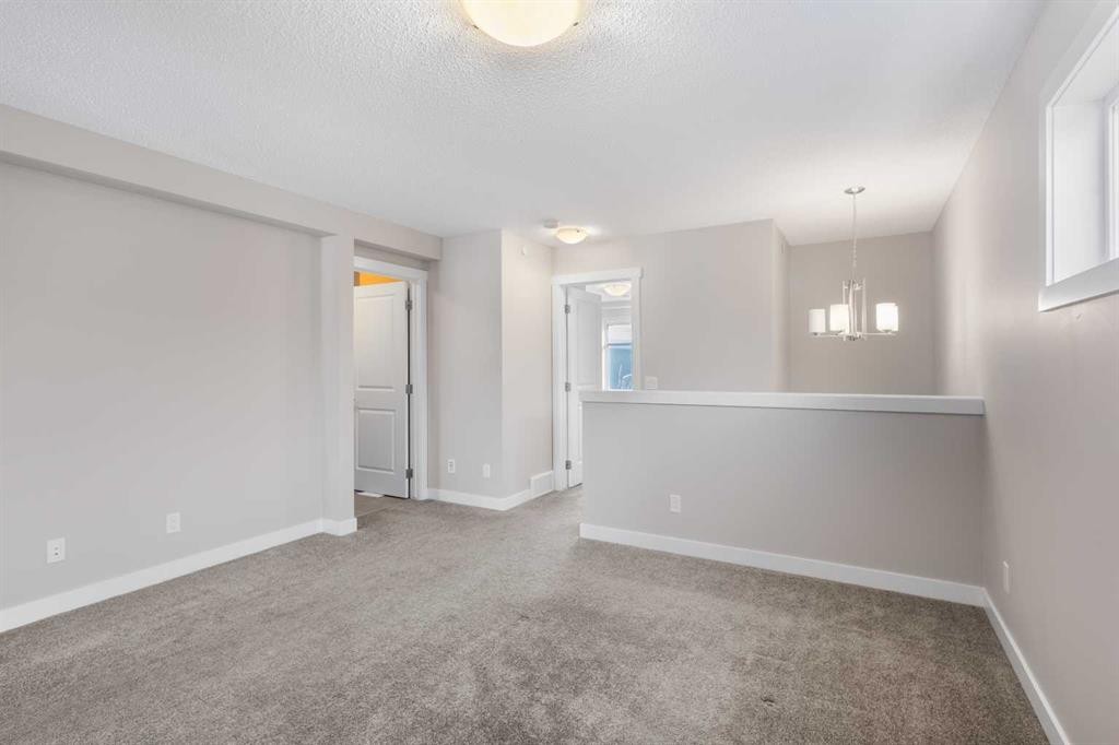 13 Howse Row Ne, Calgary, AB - Indoor Photo Showing Other Room