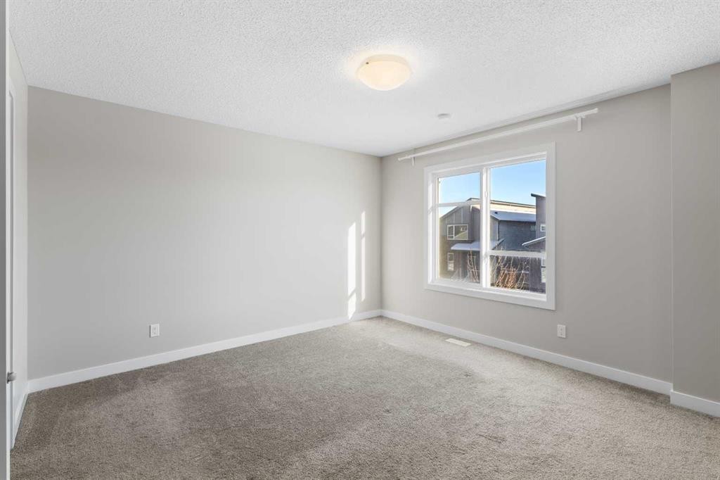13 Howse Row Ne, Calgary, AB - Indoor Photo Showing Other Room