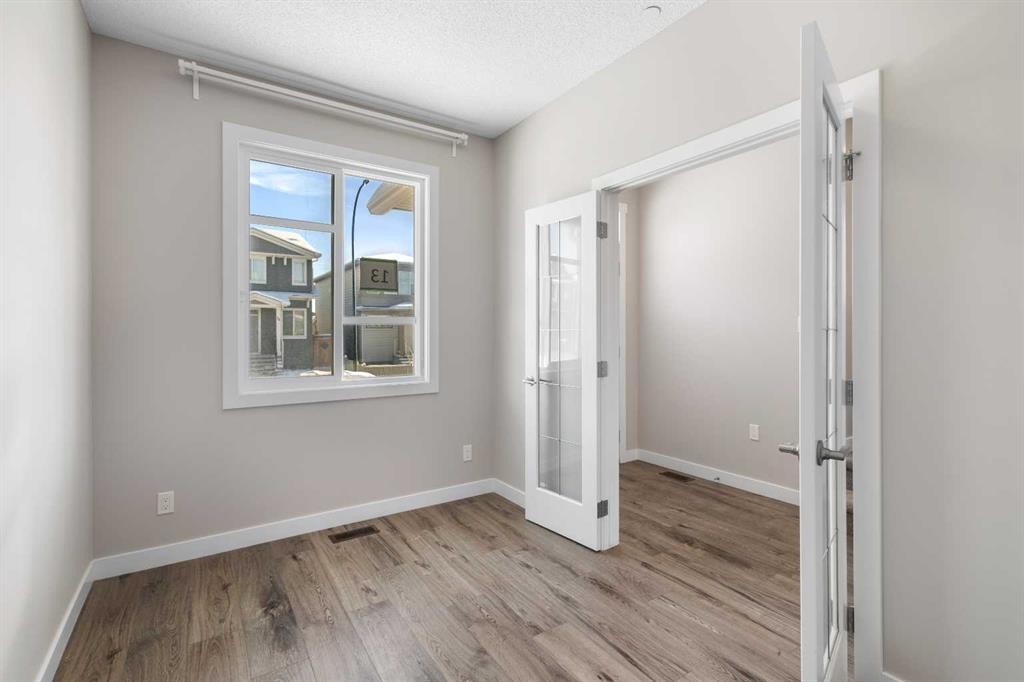 13 Howse Row Ne, Calgary, AB - Indoor Photo Showing Other Room
