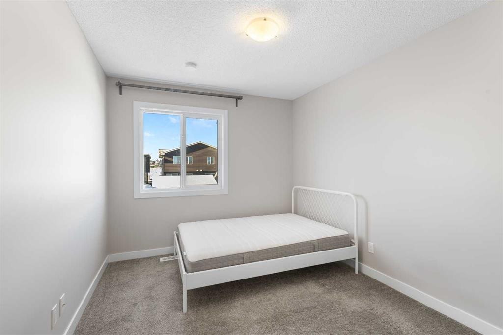 13 Howse Row Ne, Calgary, AB - Indoor Photo Showing Bedroom