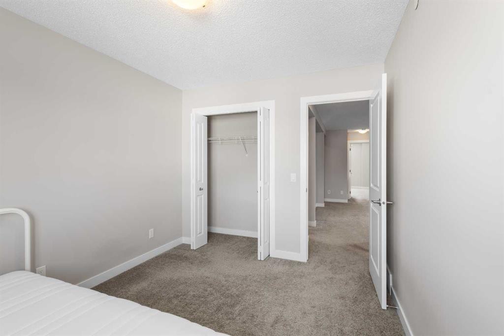 13 Howse Row Ne, Calgary, AB - Indoor Photo Showing Bedroom