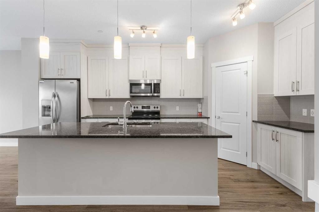 13 Howse Row Ne, Calgary, AB - Indoor Photo Showing Kitchen With Stainless Steel Kitchen With Upgraded Kitchen
