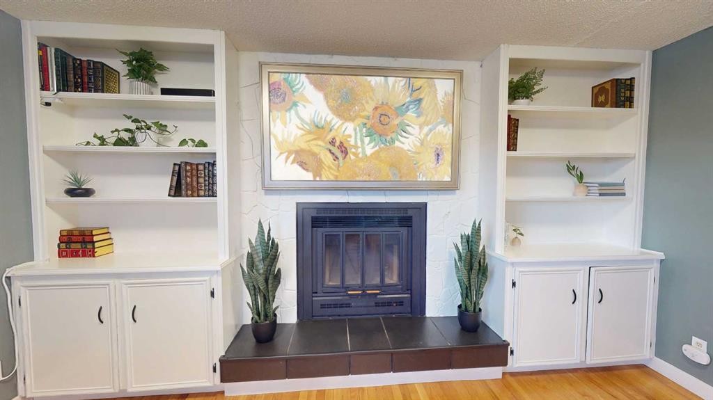 84 Sunmount Road Se, Calgary, AB - Indoor Photo Showing Other Room With Fireplace