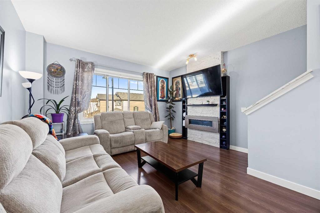 319 Taralake Way Ne, Calgary, AB - Indoor Photo Showing Living Room With Fireplace