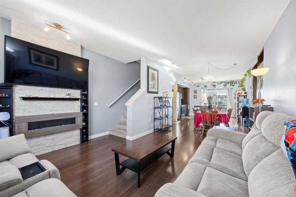 319 Taralake Way Ne, Calgary, AB - Indoor Photo Showing Living Room With Fireplace