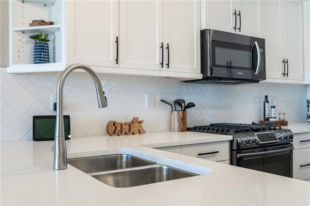 1103 Cornerstone Crescent, Olds, AB - Indoor Photo Showing Kitchen With Double Sink With Upgraded Kitchen