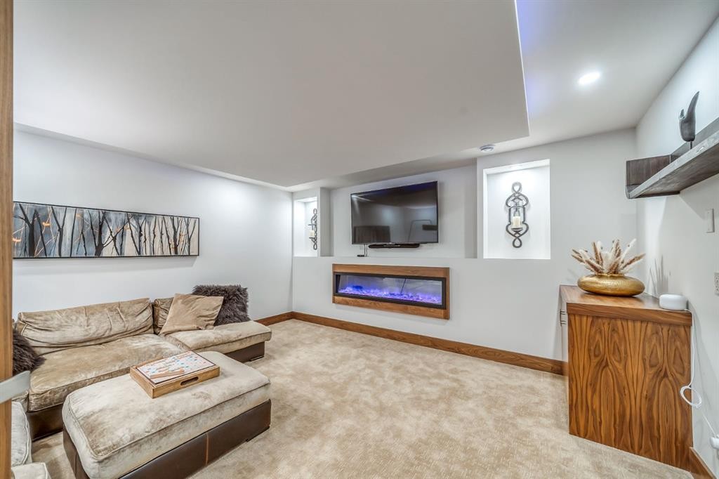 118 Cairns Landing, Canmore, AB - Indoor Photo Showing Living Room With Fireplace