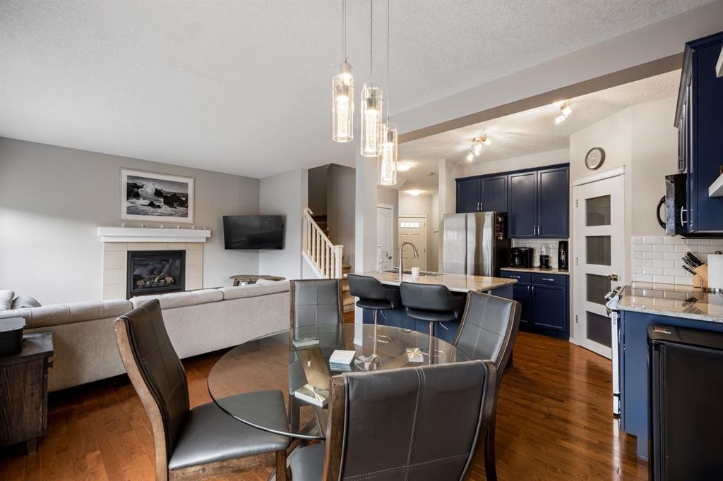 526 New Brighton Drive Se, Calgary, AB - Indoor Photo Showing Kitchen With Fireplace With Upgraded Kitchen
