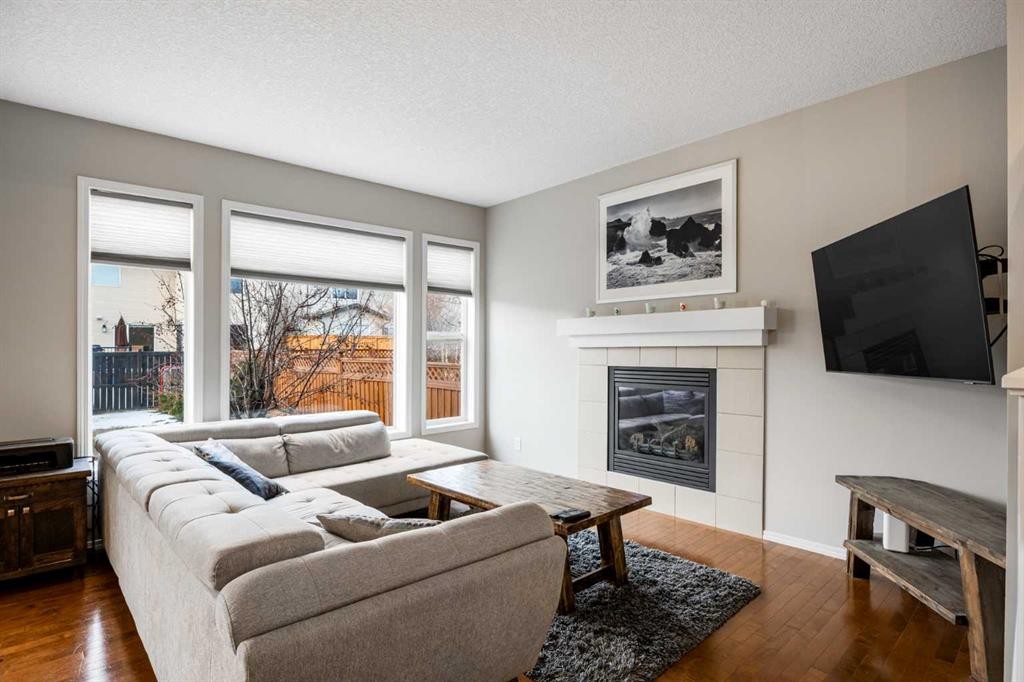 526 New Brighton Drive Se, Calgary, AB - Indoor Photo Showing Living Room With Fireplace