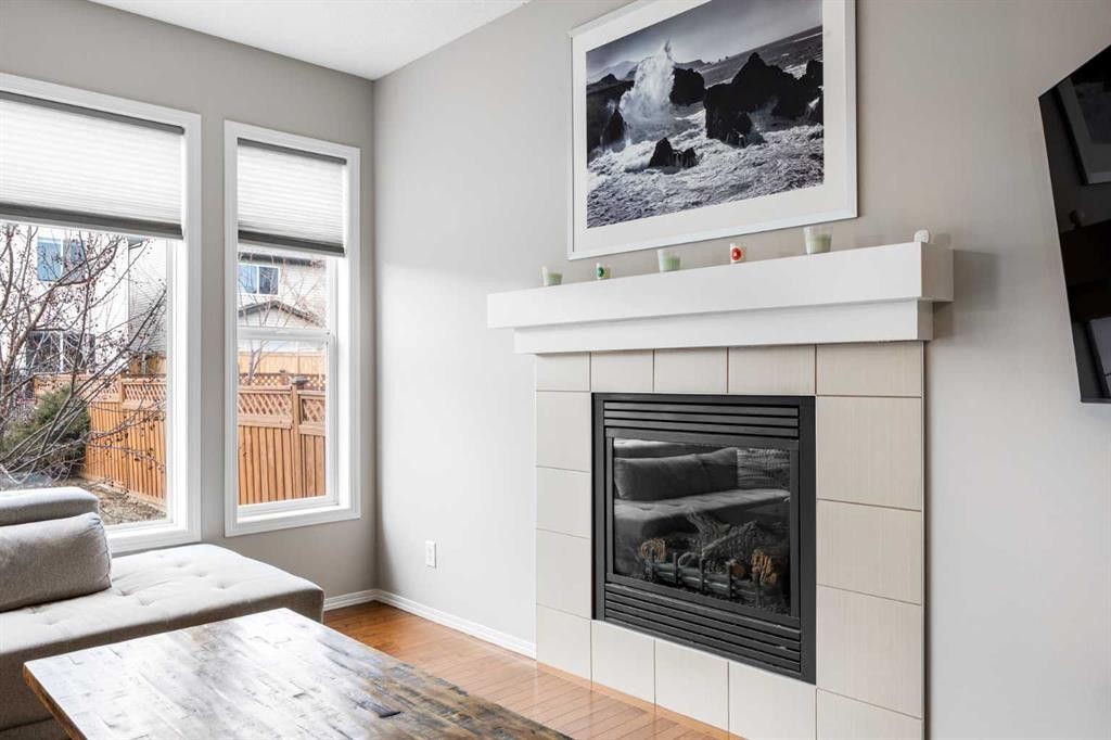 526 New Brighton Drive Se, Calgary, AB - Indoor Photo Showing Living Room With Fireplace