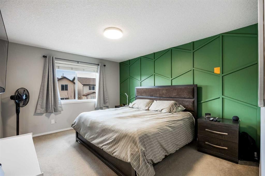 526 New Brighton Drive Se, Calgary, AB - Indoor Photo Showing Bedroom