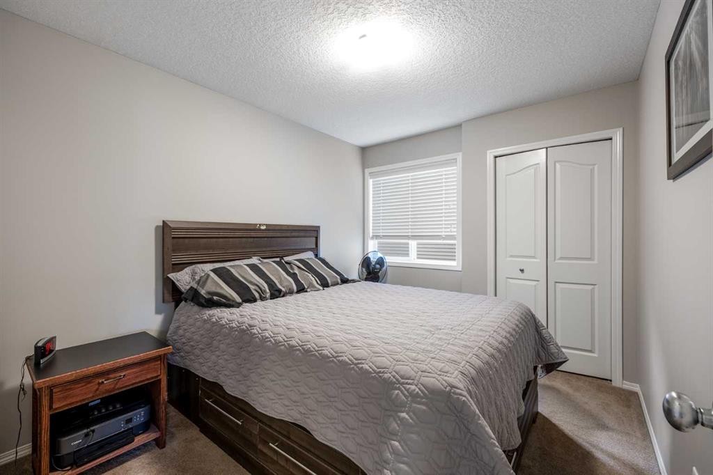 526 New Brighton Drive Se, Calgary, AB - Indoor Photo Showing Bedroom