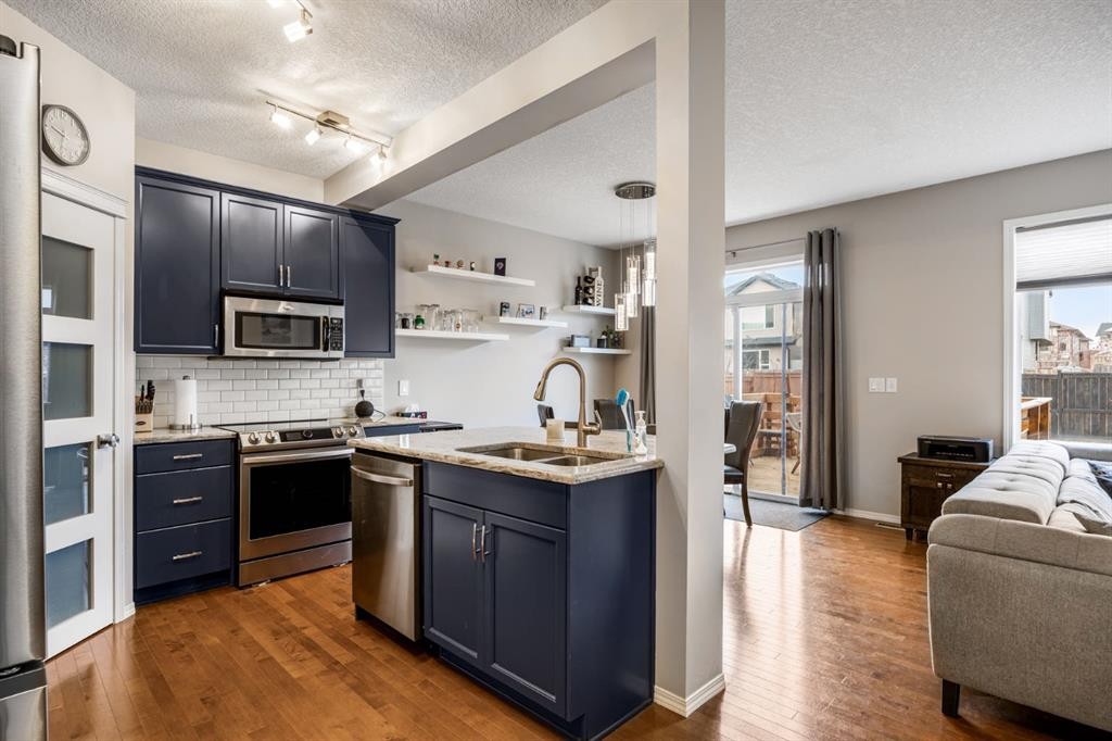 526 New Brighton Drive Se, Calgary, AB - Indoor Photo Showing Kitchen With Double Sink With Upgraded Kitchen