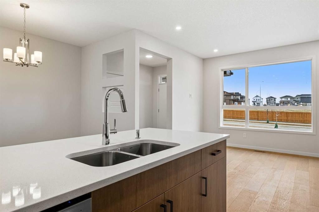 117 Bridgeport Gate, Chestermere, AB - Indoor Photo Showing Kitchen With Double Sink
