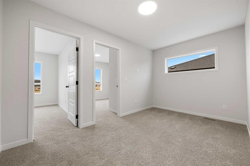 117 Bridgeport Gate, Chestermere, AB - Indoor Photo Showing Other Room