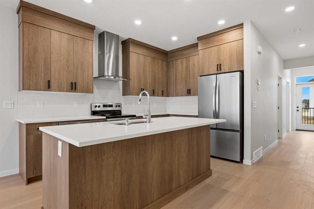 117 Bridgeport Gate, Chestermere, AB - Indoor Photo Showing Kitchen With Double Sink With Upgraded Kitchen