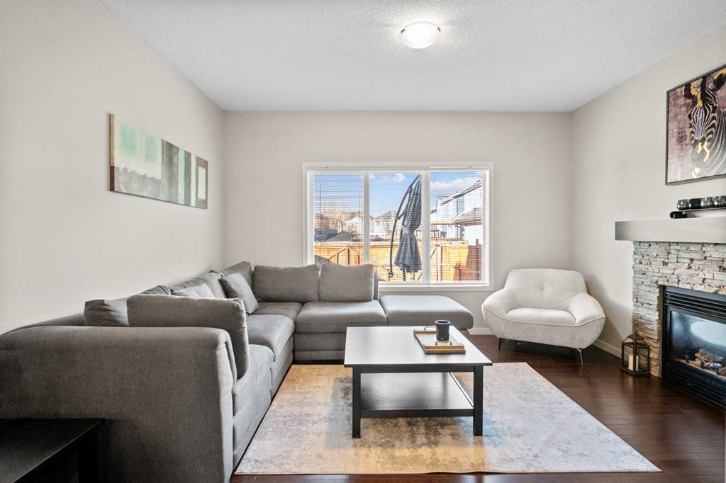 112 Copperpond Park, Calgary, AB - Indoor Photo Showing Living Room With Fireplace