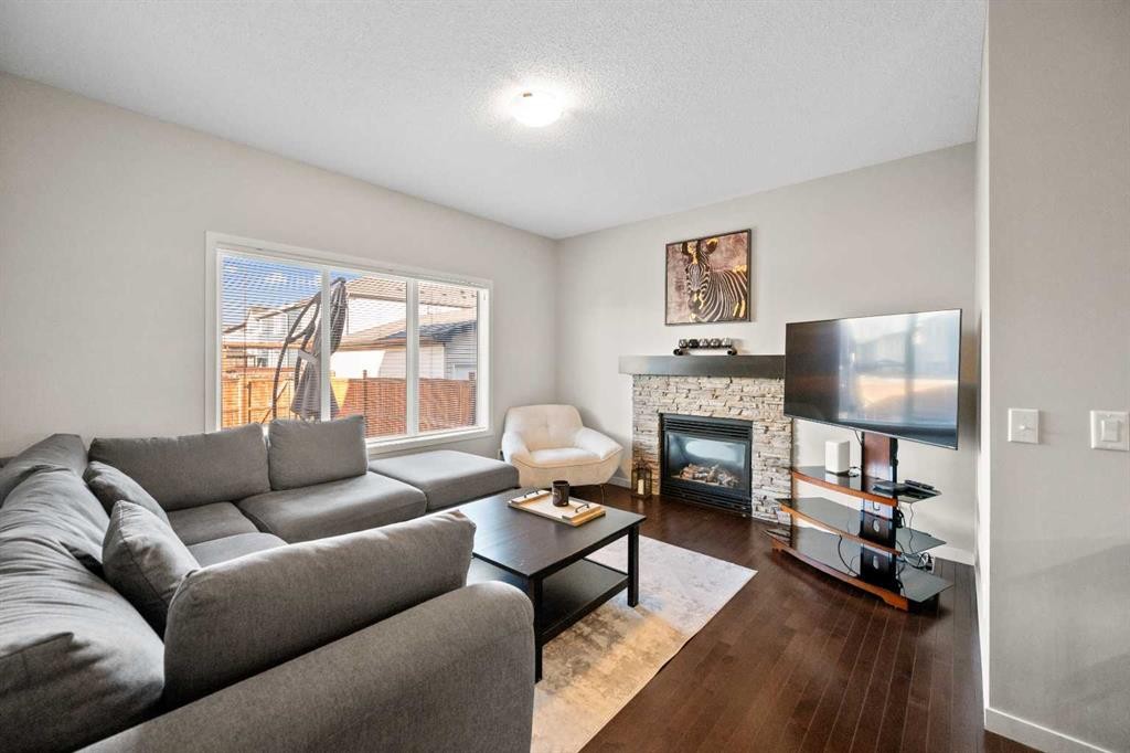 112 Copperpond Park, Calgary, AB - Indoor Photo Showing Living Room With Fireplace