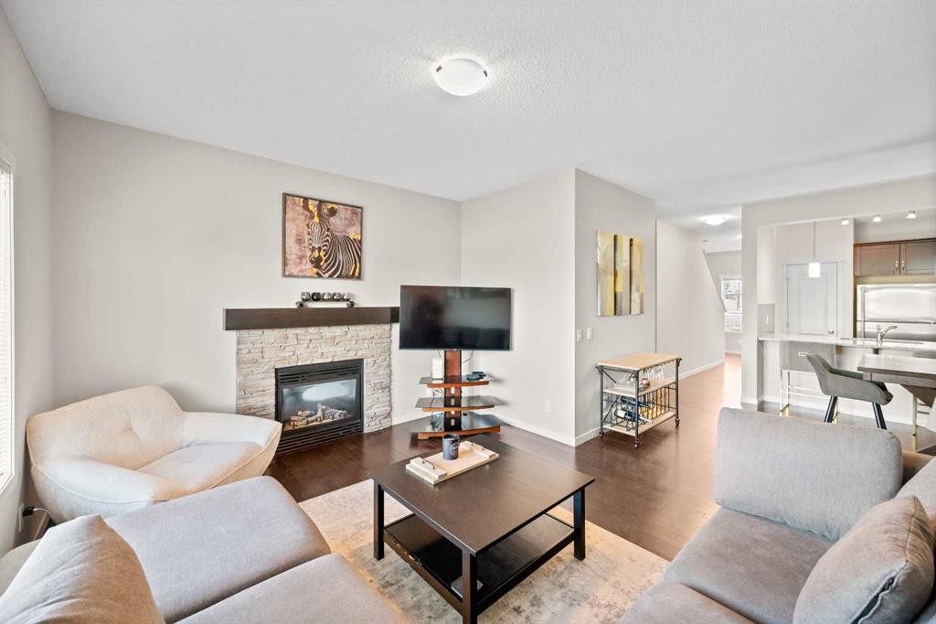 112 Copperpond Park, Calgary, AB - Indoor Photo Showing Living Room With Fireplace
