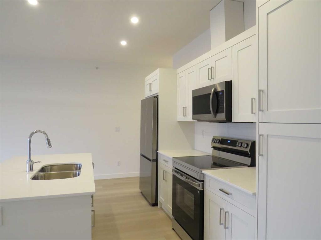 403-70 Sage Hill Walk Nw, Calgary, AB - Indoor Photo Showing Kitchen With Stainless Steel Kitchen With Double Sink