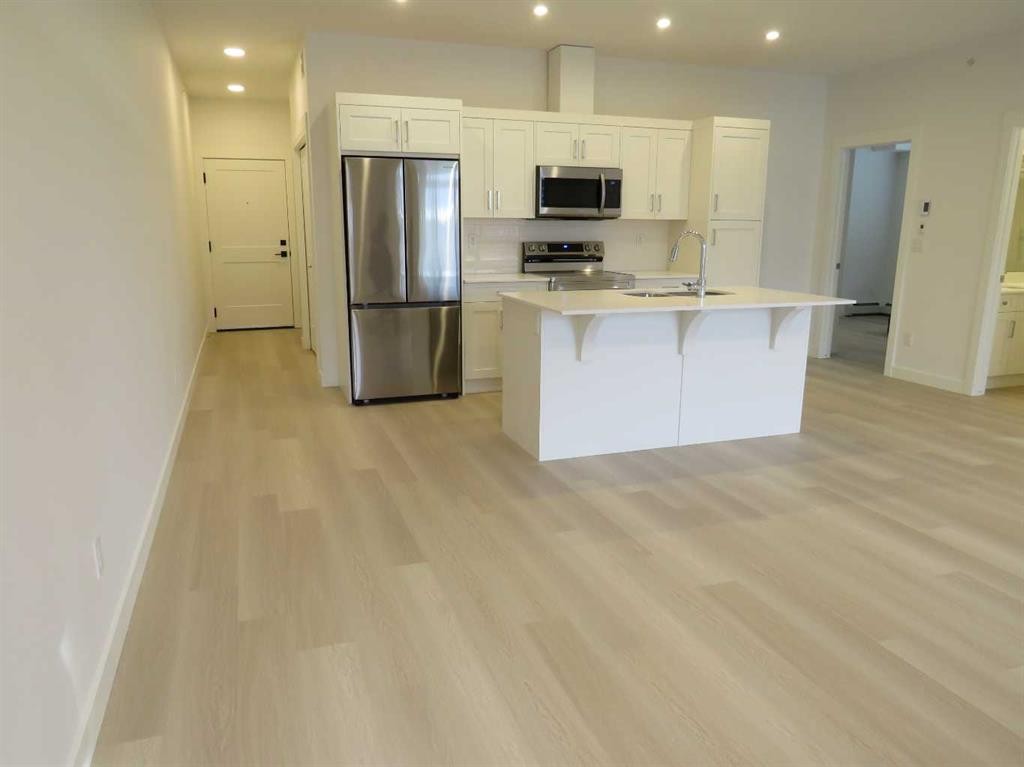 403-70 Sage Hill Walk Nw, Calgary, AB - Indoor Photo Showing Kitchen With Stainless Steel Kitchen With Double Sink
