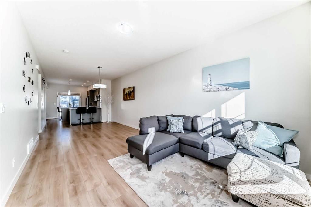 240 Copperleaf Way Se, Calgary, AB - Indoor Photo Showing Living Room